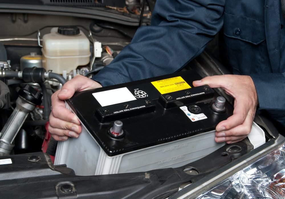 auto-mechanic-replacing-car-battery.jpg